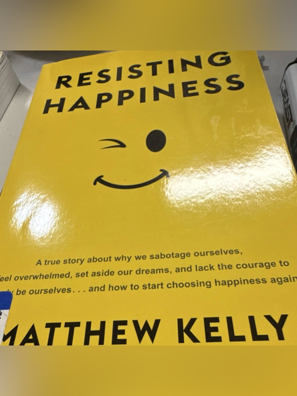 Resisting Happiness by Matthew Kelly - Bright Yellow Cover